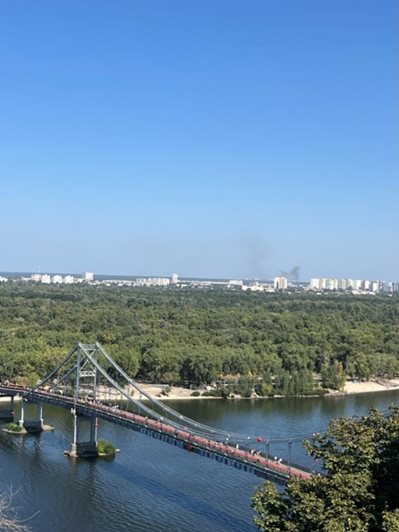 Kyiv Dnieper bridge with smoke